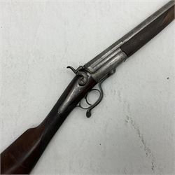19th century lightweight 20-bore single barrel shotgun with best curly damascus 76cm barrel in original black powder proof; screw underlever opening; walnut stock with chequered grip and fore-end; serial no.21448 L117.5cm overall SHOTGUN CERTIFICATE REQUIRED
