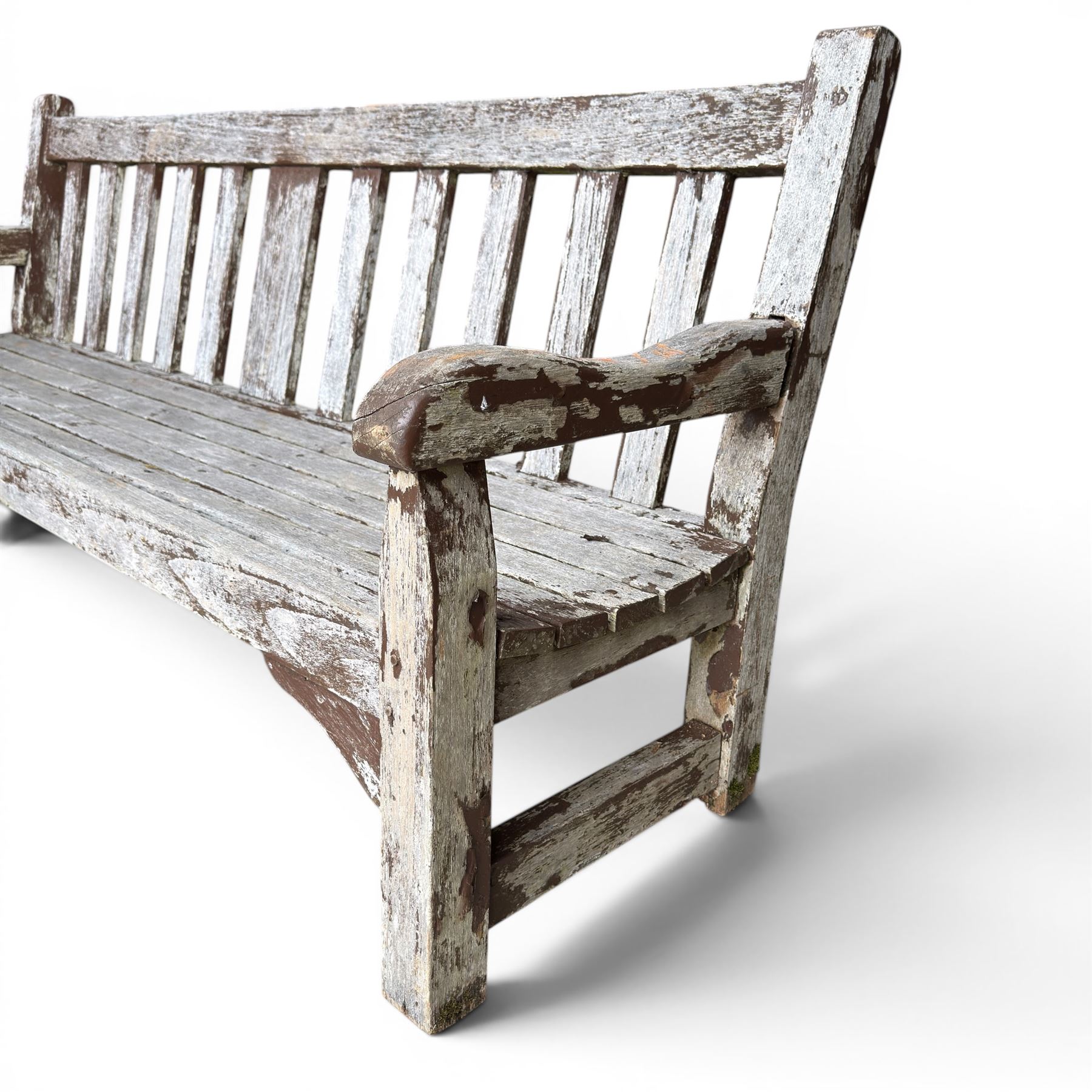 Teak garden bench with slatted back and seat on square supports in weathered which finish 