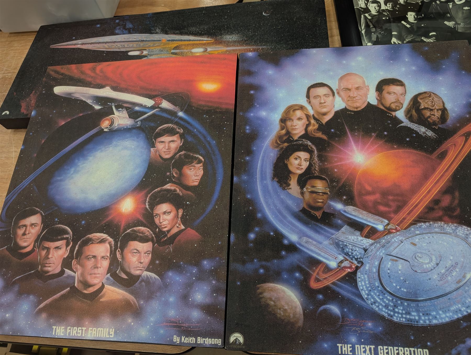 Collection of Star Trek The Next Generation and Deep Space Nine memorabilia, including two limited edition signed Star Trek Deep Space Nine photographs, commemorative porcelain plaque, insignias, Encounter at Farpoint pewter plaque, signed photograph of the Voyager crew, two signed copies of Convergence and a signed War & Madness graphic novel, canvas prints and other signed photos, together with Star Wars Ray Park (Darth Maul) signed photograph, UFO and Buck Rogers memorabilia