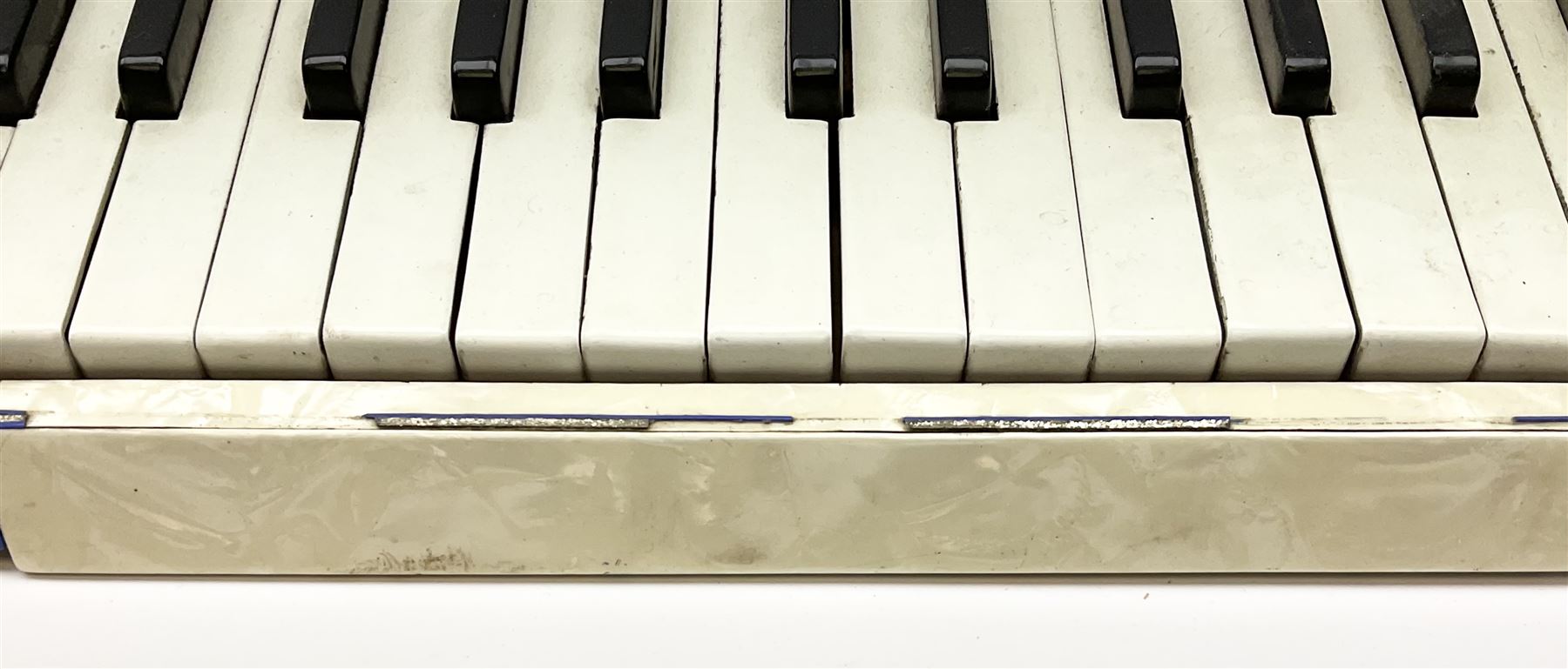 Italian Lambardi piano accordion in ivory coloured pearline case with jewelled decoration, twenty keys and one-hundred and twenty buttons L 37cm