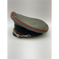 WW2 German Army Artillery officer's peaked cap, red piping to the crown and bordering the central band, zinc eagle and aluminium cockade insignia, officer's bullion chin cords, interior retains original sweatband and lining has tailor's celluloid diamond with 'Extra Klasse' logo and 'Marke Standard'
