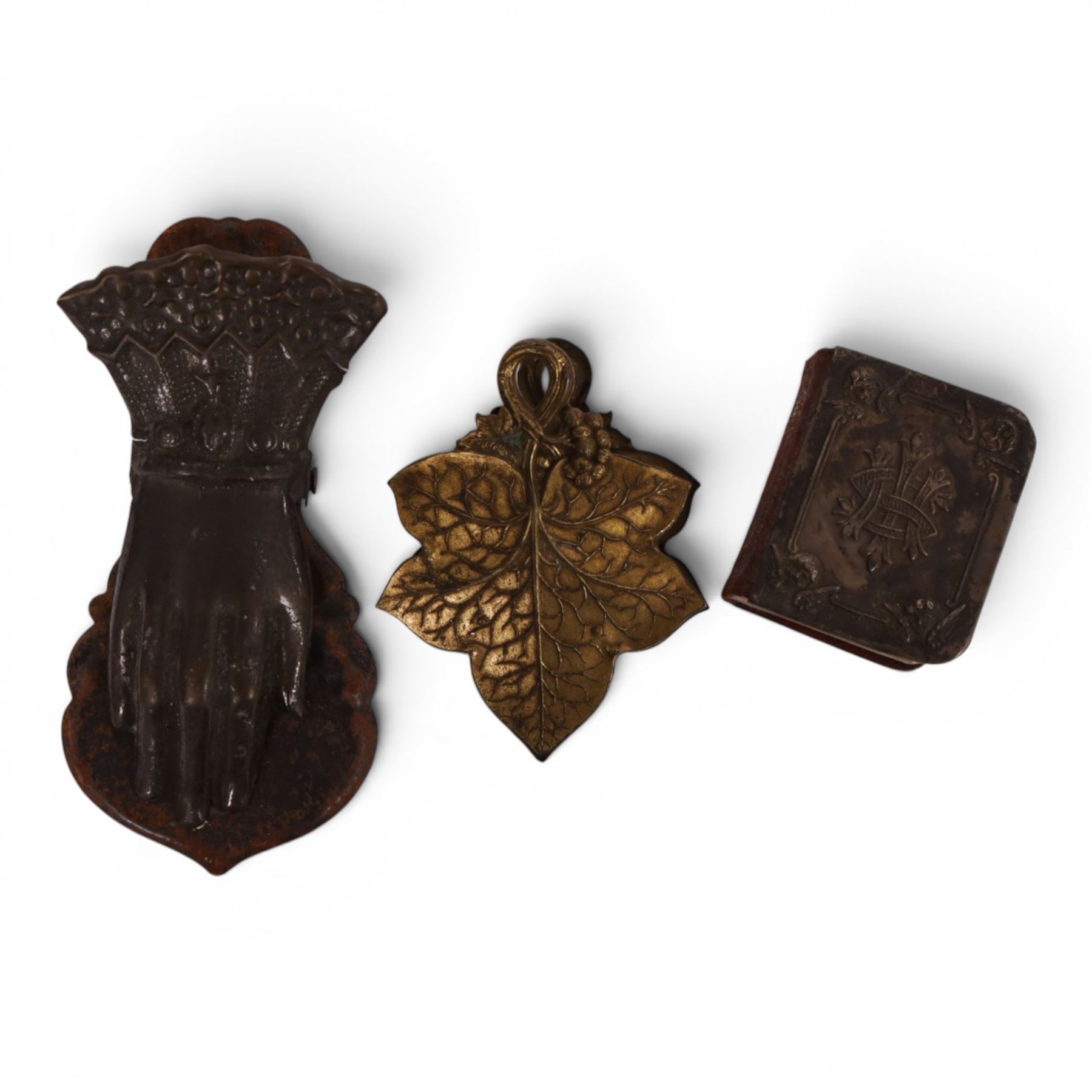 Miniature common prayer book with silver cover, hallmarked, together with brass letter clip if the form of a vine leaf, together with another letter clip in the form of a hand