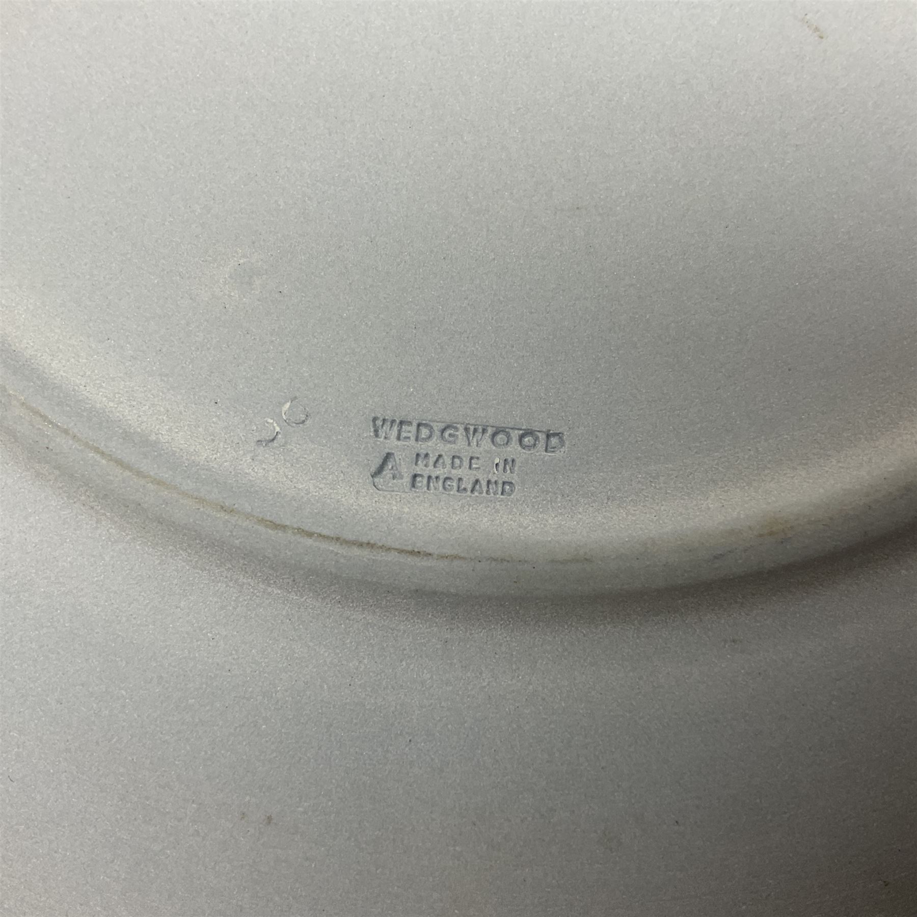 Group of William Wilberforce Abolition of Slavery items, comprising Wedgwood black on cane Jasperware pin tray, Wedgwood light blue Jasperware plate, and two Wedgwood oval medallion pendants, each depicting a kneeling figure beneath the inscription 'AM I NOT A MAN AND A BROTHER?', an Eastgate pottery plaque decorated in relief with a kneeling figure before William Wilberforce, a Hull Museum Publications pamphlet titled 'Medals, Tokens, etc., Issued in Connection with William Wilberforce and the Abolition of Slavery', by Thomas Sheppard, dated 1916, and an antique print depicting William Wilberforce after the original portrait by George Richmond, (7)
