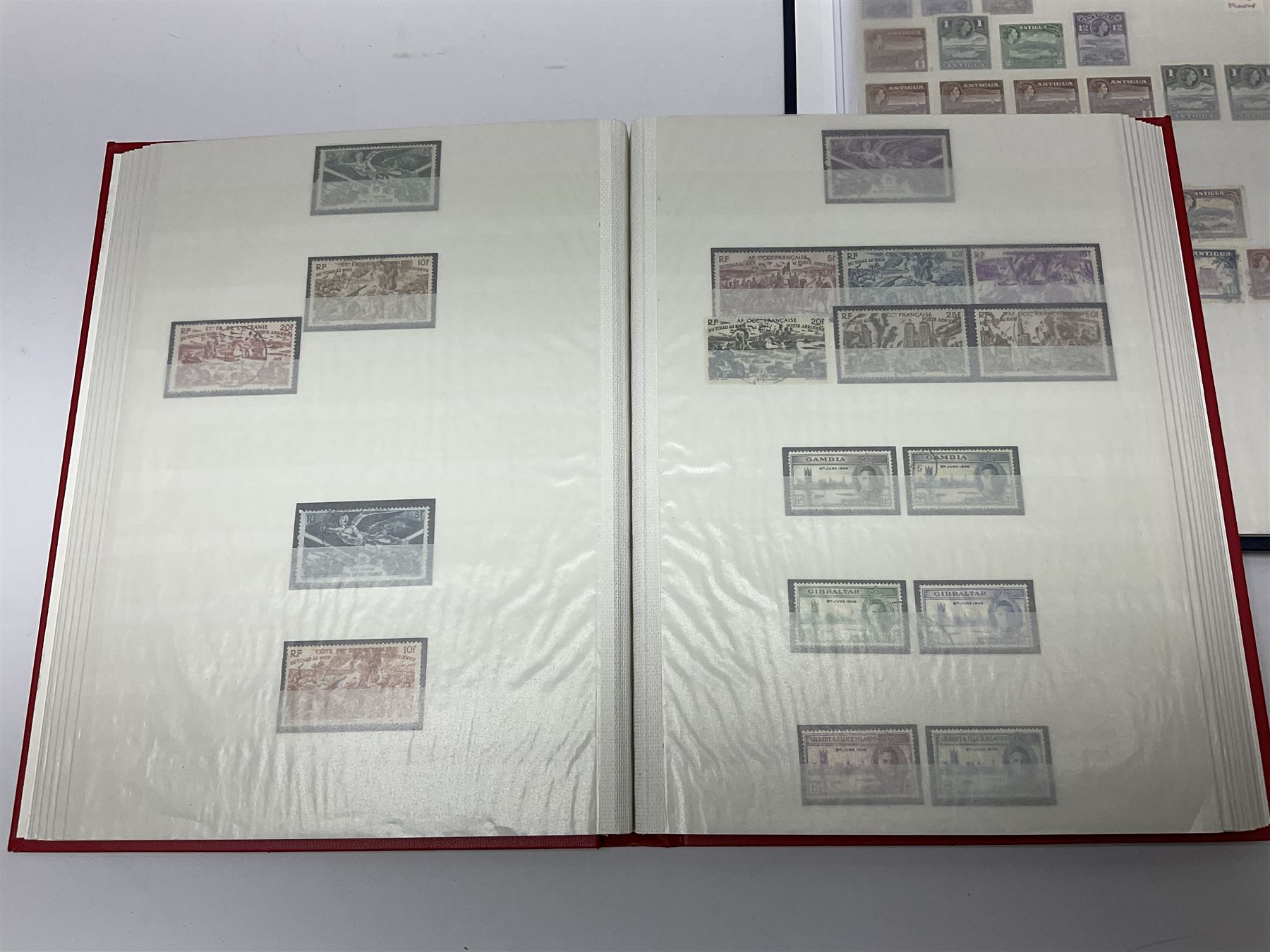 World stamps with many relating to Victory in Europe including King George VI '8th June 1946' stamps from various countries including Antigua, British Guiana, British Honduras, British Solomon Islands, Cayman Islands, Ceylon, Fiji, Grenada, Montserrat, St Helena etc, both mint and used stamps seen, housed in three stockbooks
