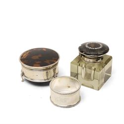 Silver circular ring box with hinged tortoiseshell cover, glass block inkwell with pique t...