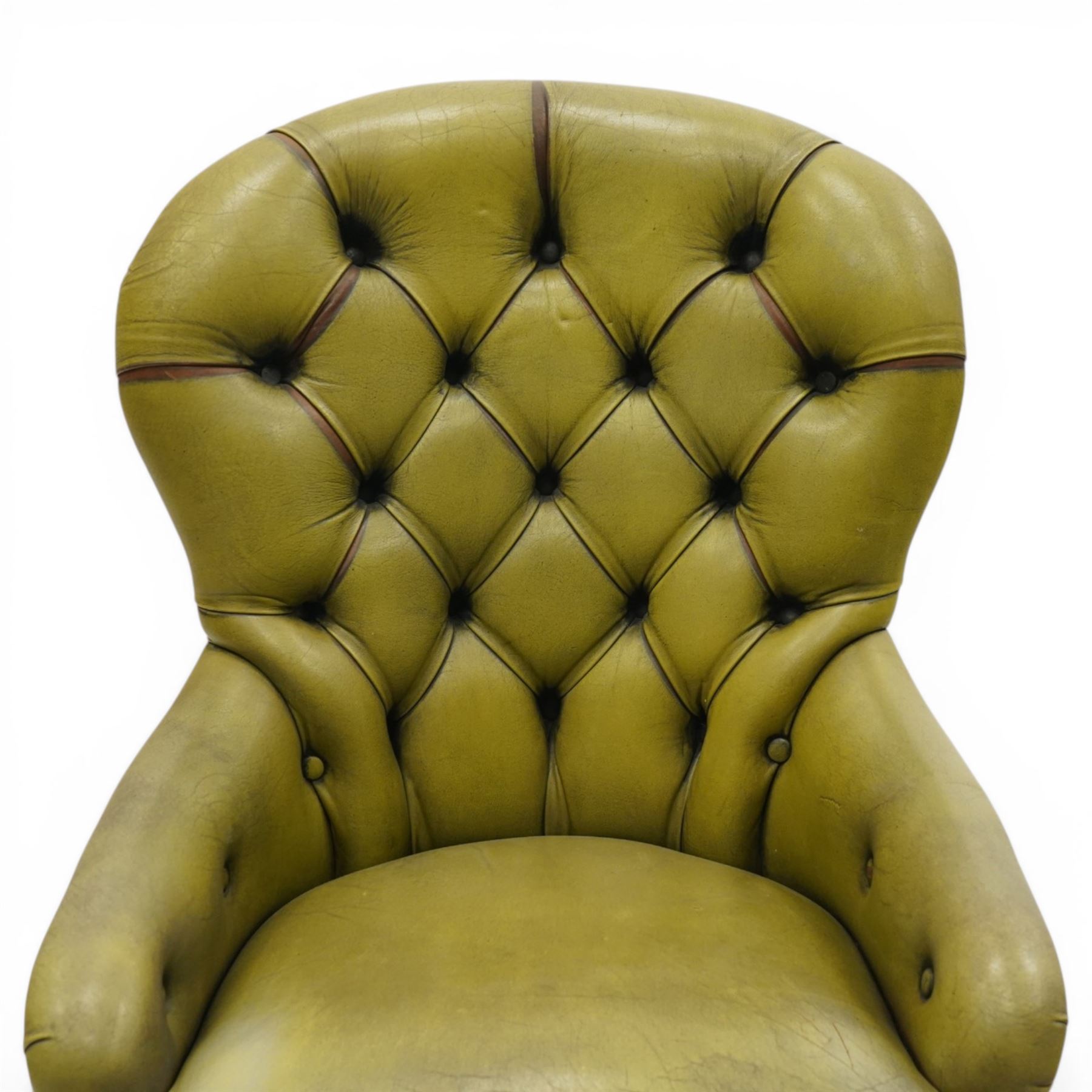 Victorian design tub armchair upholstered in buttoned green leather, on turned front supports