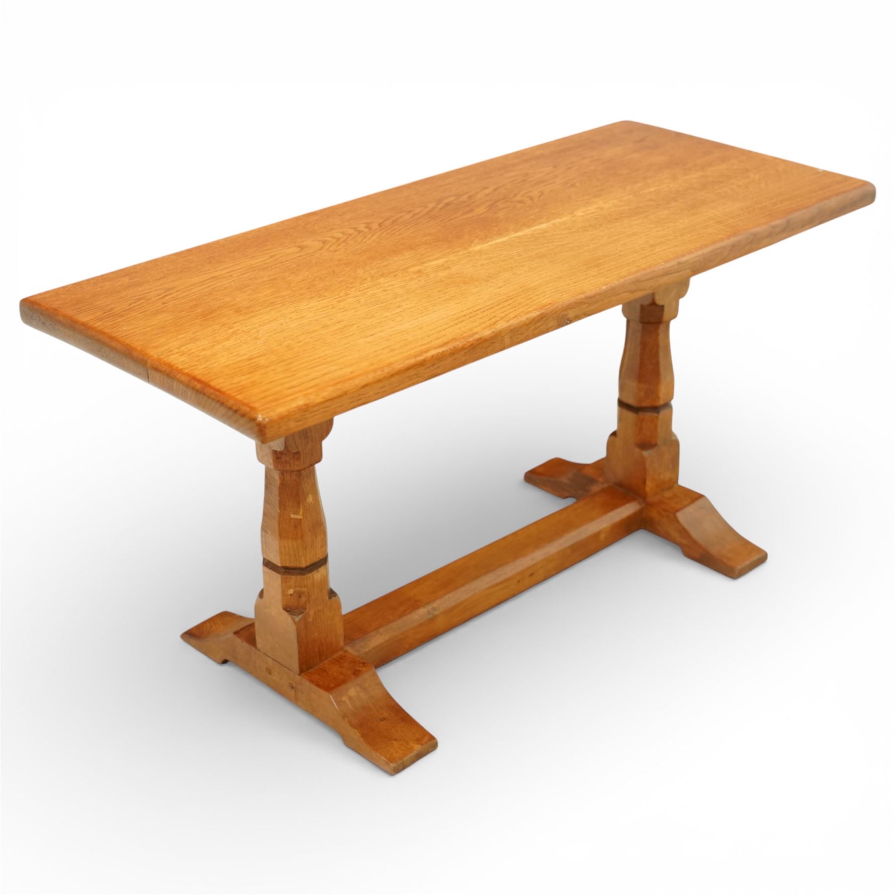 Sid Pollard of Thirsk - Yorkshire oak coffee table, rectangular adzed top with softly moulded edge, raised on twin octagonal baluster supports, united by a plain stretcher, on shaped splayed feet