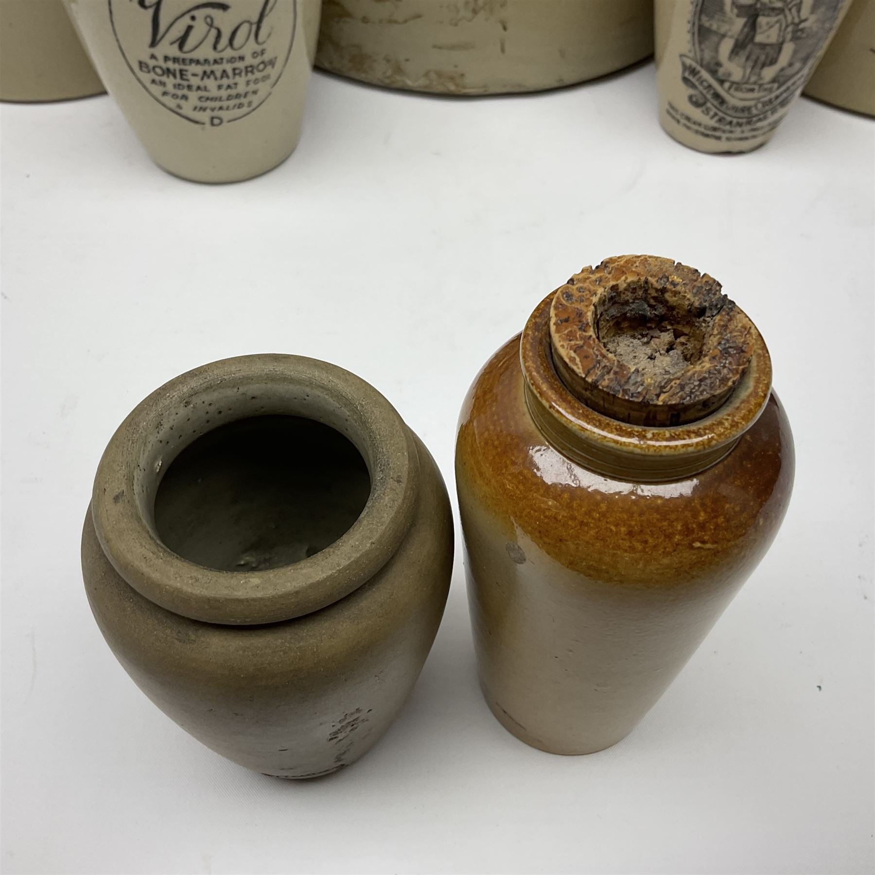 Large 2 gallon stoneware flagon, stamped 'John Soulby Wine Merchant Malton 2 Gall', together with a collection of similar stoneware jars and bottles, largest H40.5cm