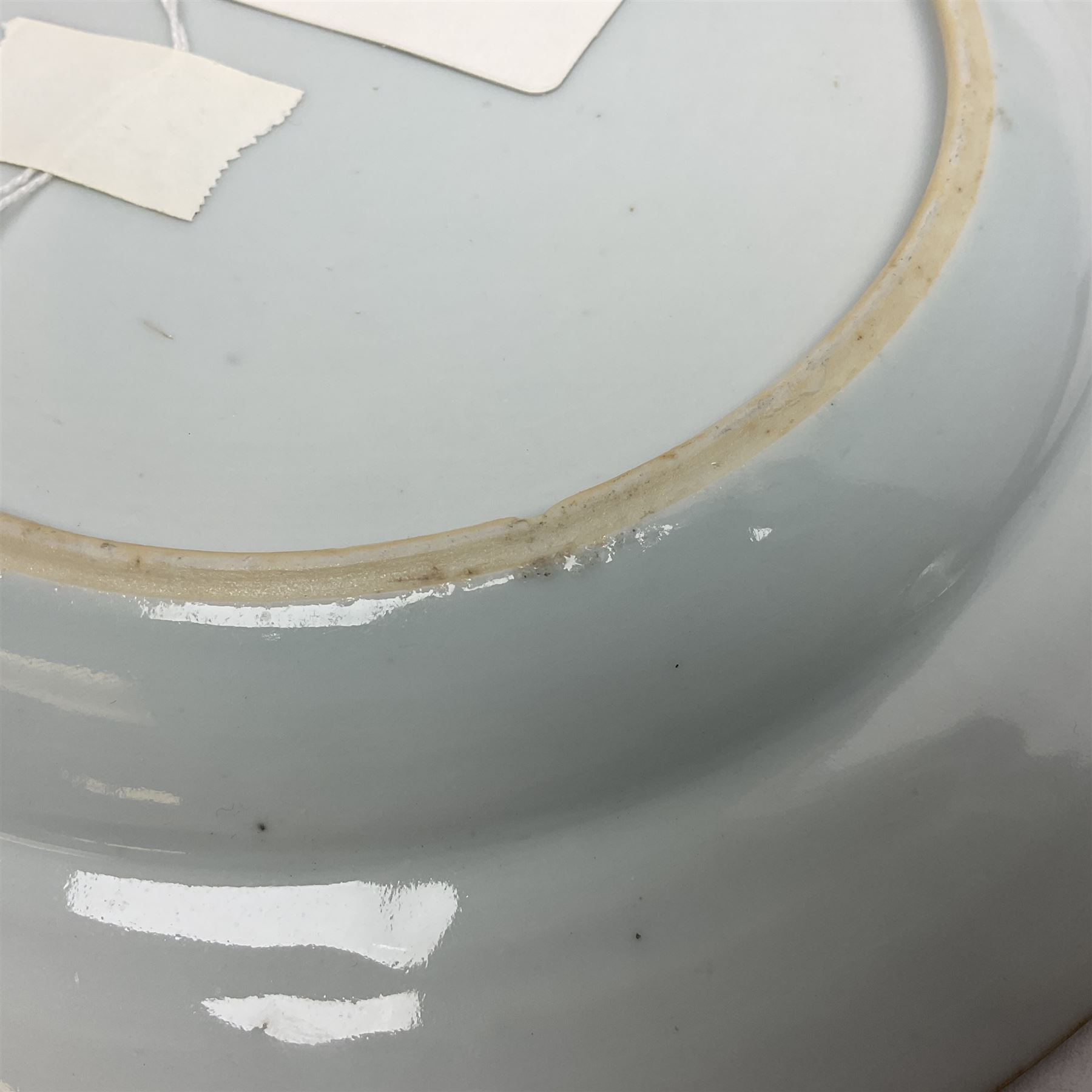 Japanese Meiji period Arita blue and white plate, of circular form, painted with riverside landscape and bird upon flowering branch, with character mark beneath, D24.5cm, together with two 18th century Chinese blue and white plates, each painted with floral design, each approximately D22.5cm