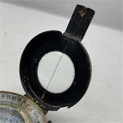 WWII British marching compass, the black lacquered brass case inscribed T.G.Co.Ltd. No.B100228 (broad arrow) 1941 Mk.III; and a ship's brass cased clinometer, the silvered dial marked R(arrow)L, D9cm; in leather carrying case (2)