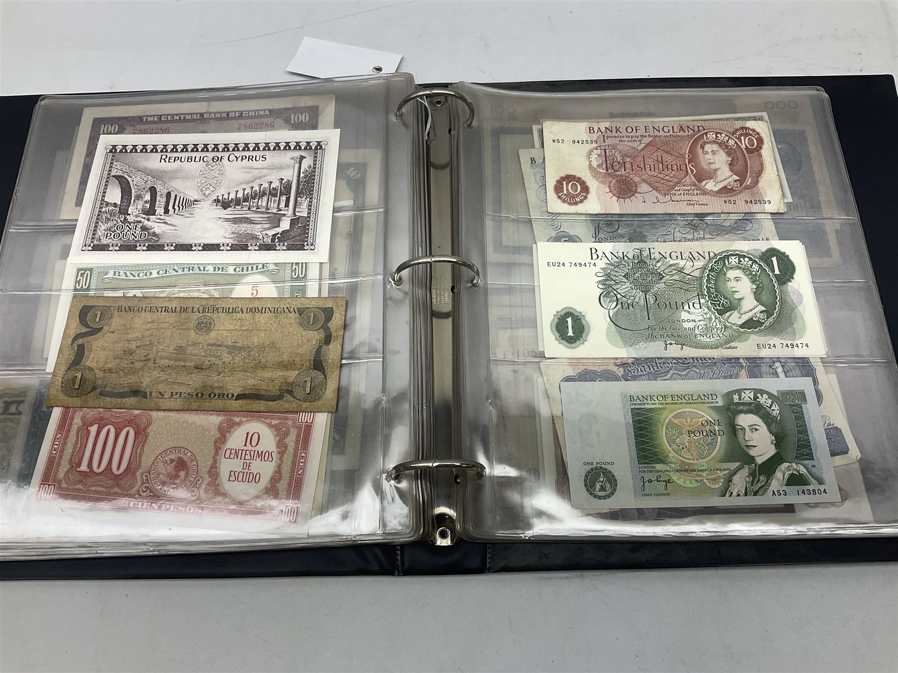 World banknotes, including Queen Elizabeth II The States of Jersey one pound 'DB202703', five pounds 'BB527762' and ten pounds 'AB651481', reserve bank of New Zealand two dollars '1L3 741894', King George V Straits Settlements one dollar 1st January 1935 'F/83 28924', various Bank of England notes etc, housed in two ring binder albums