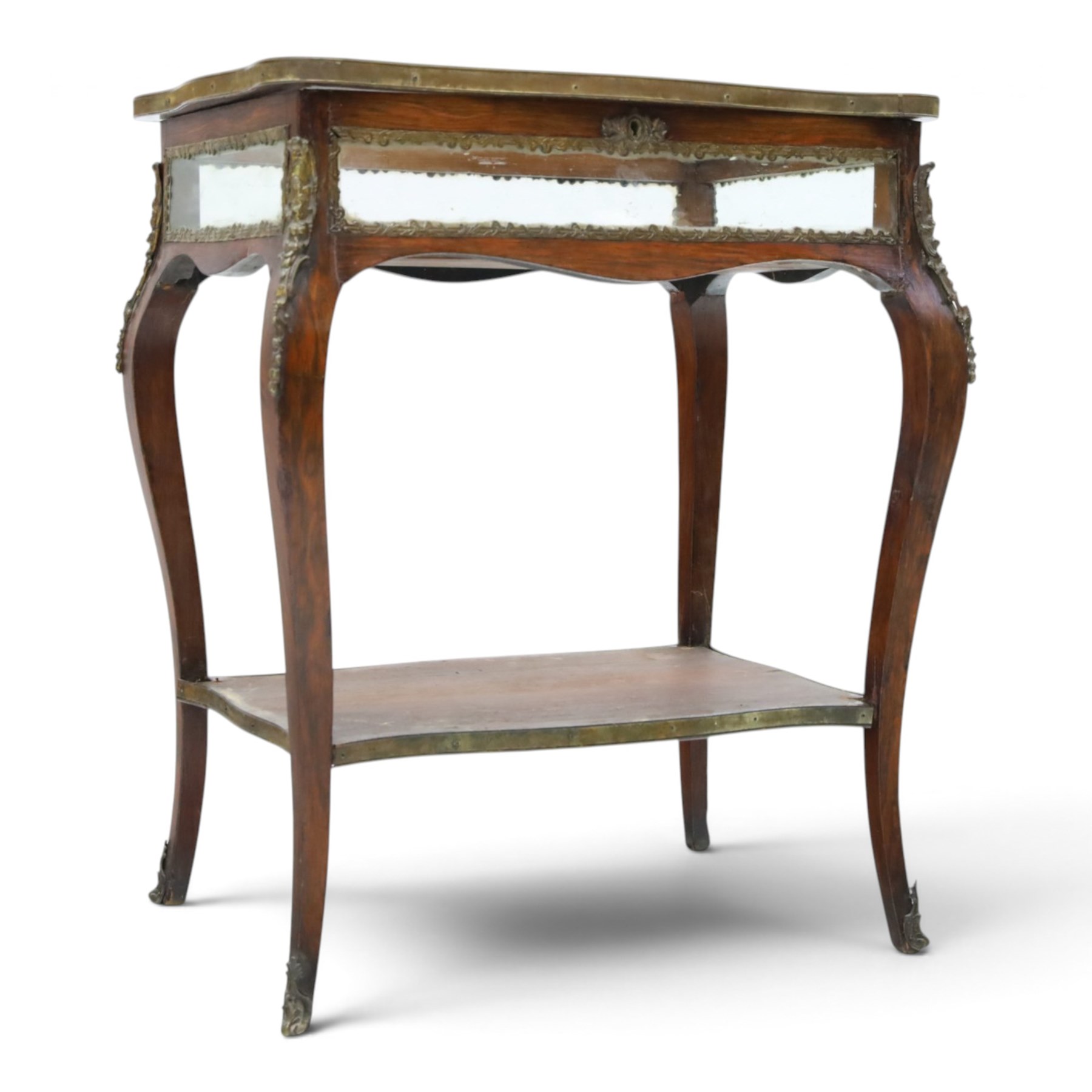 Louis XV style rosewood and marquetry bijouterie table,  glazed hinged top within a floral marquetry border and gilt metal moulded edge, above glazed sides and a baize lined interior, raised on cabriole legs with gilt metal mounts and sabots, united by an undertier