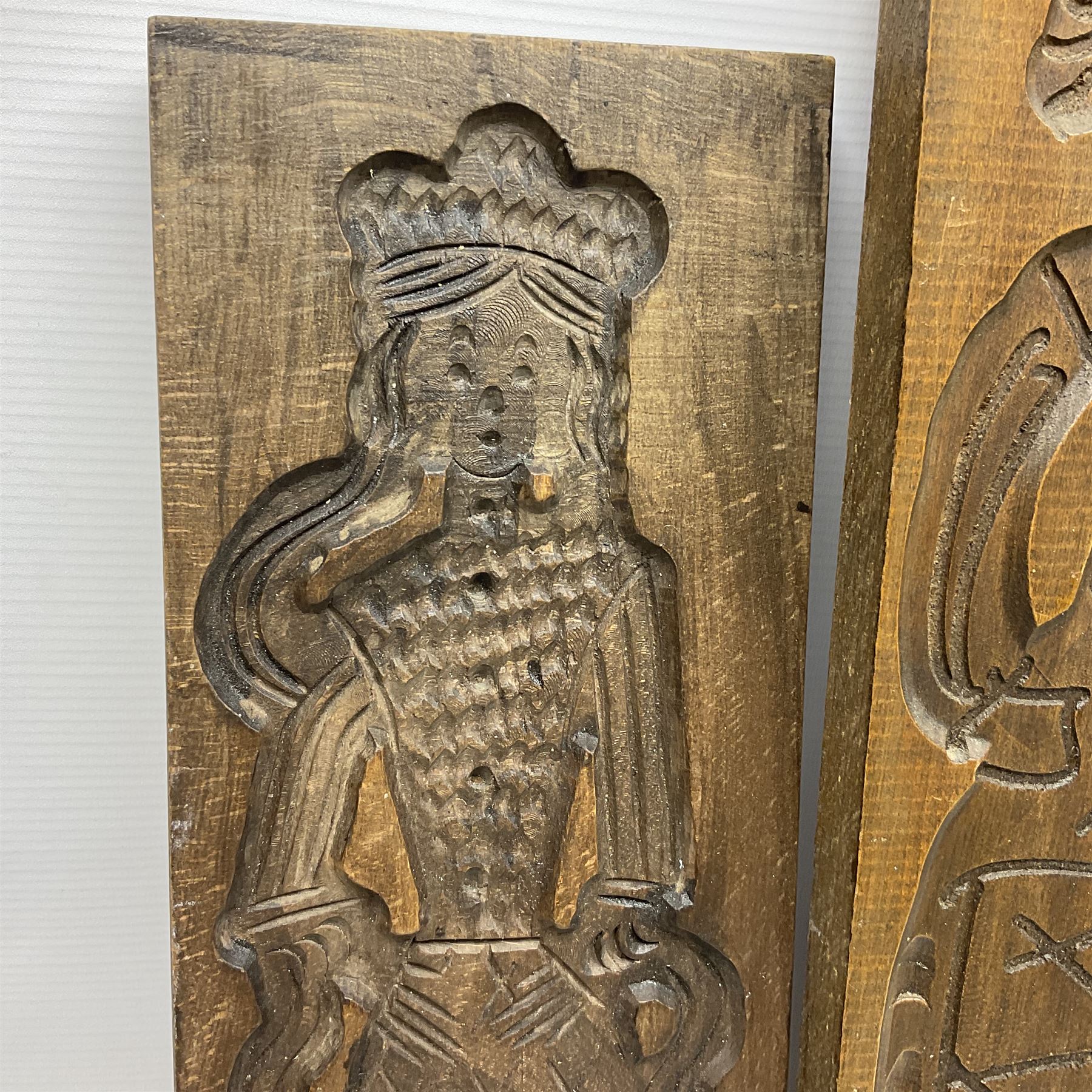 Six 20th century hardwood Dutch folk art Speculaasplank or biscuit moulds, typically carved with figures in traditional dress, largest H101cm