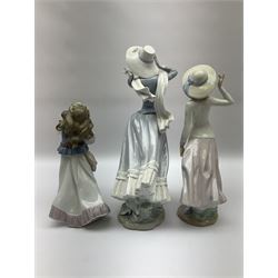 Three Lladro figures, comprising, Dreams of Summer Past no 6401, Spring Breeze no 4936 and Breezy Afternoon 5682 together with Lladro plaque Art Brings us Together no 7677, all in original boxes, largest example H35cm