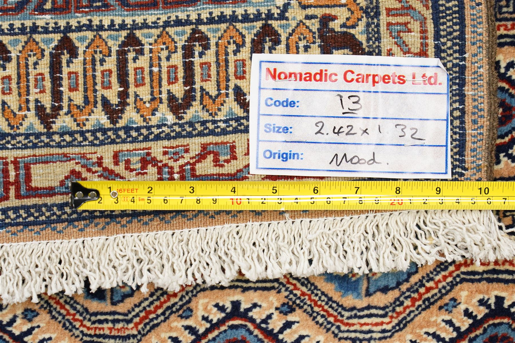 North East Persian Moud hand-knotted carpet, ivory field with an-over Herati inspired lattice of repeating lozenge and diamond motifs, with stylized floral devices and angular vinery in tones of sky blue, indigo, madder red and camel, principal border with a sequence of stylized palmettes and angular vine motifs, framed by narrow guard stripes, with cotton fringe ends