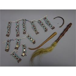  Two African waist or neck ornaments, each with 'loveletters' of multicoloured beads hung in lozenge decorated panels or tabs with Mother of Pearl roundels, Xhosa/Mfengu style, Zulu Fly Whisk with painted ribbed leather bound wooden handle, L50cm max, a plaited and twisted wire strand bracelet and a shaped wooden drumstick (5)   