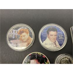 Three United States of America 2002 one ounce fine silver coins each with applied Elvis commemorative stickers, Queen Elizabeth II Bailiwick of Guernsey 2000 silver one pound coin and a Maria Theresa restrike thaler (5)