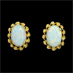Pair of 9ct gold opal stud earrings, stamped