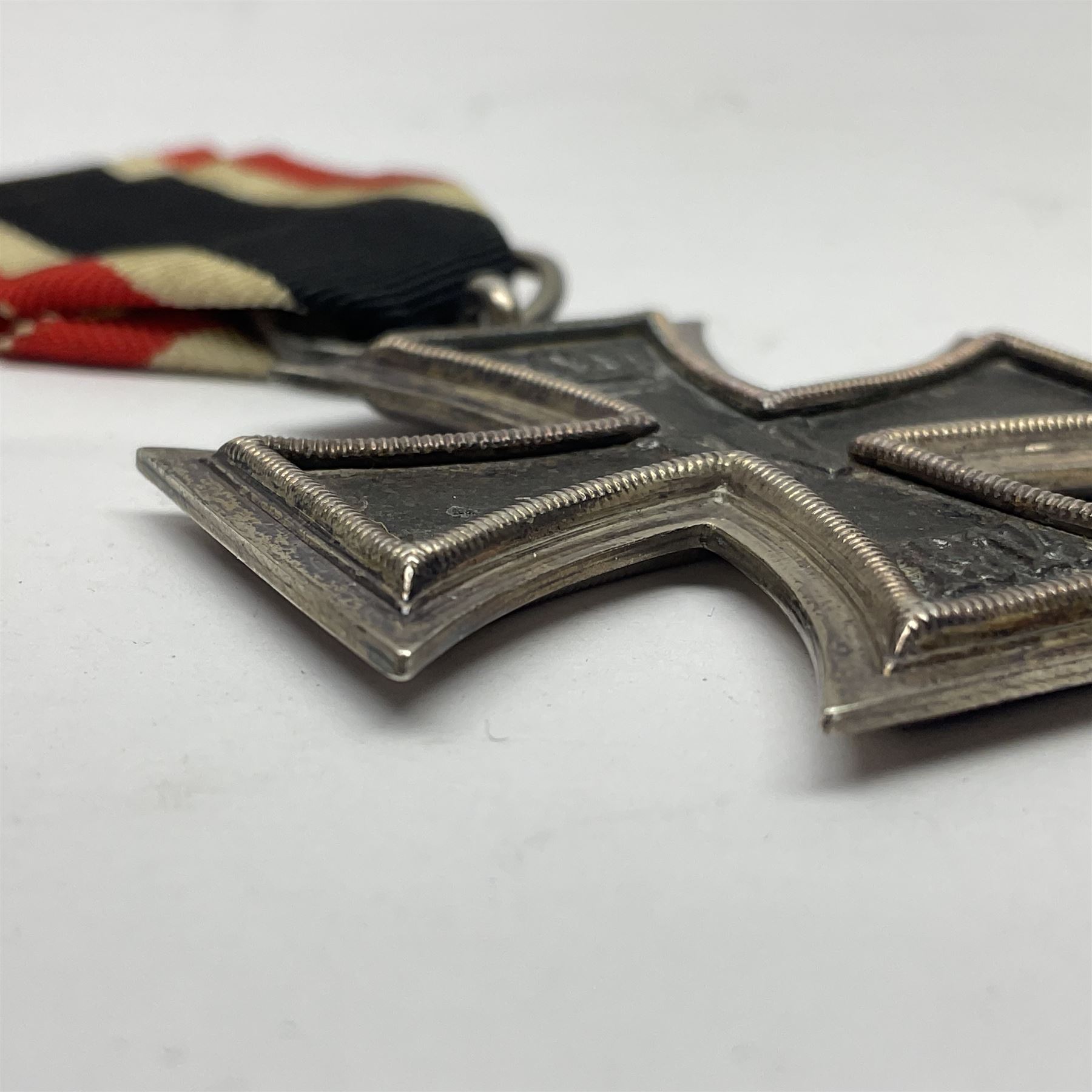 WWI Imperial German Iron Cross 2nd Class, the suspension ring indistinctly stamped M8?; with WWII ribbon