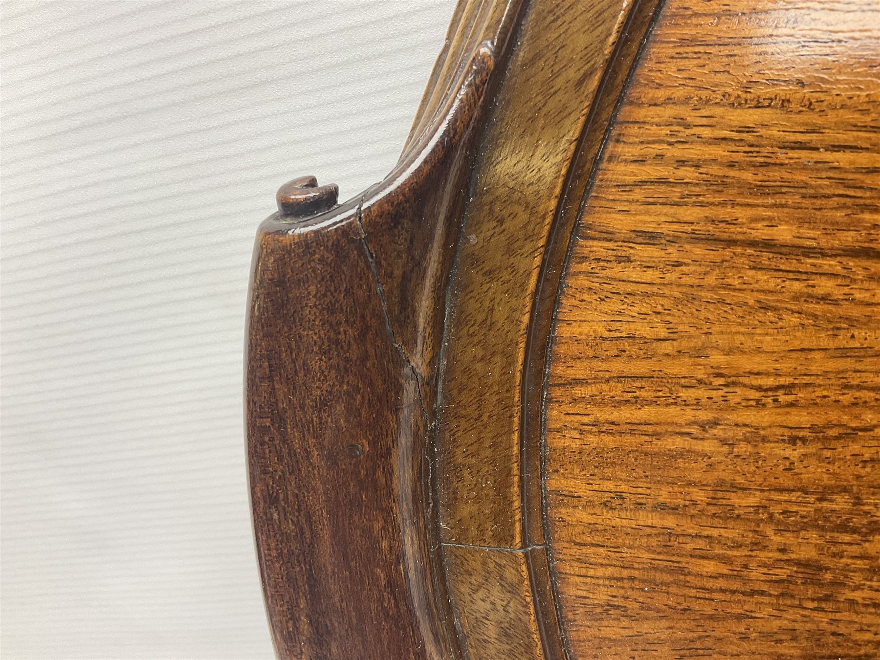 Late 19th/early 20th century mahogany and marquetry inlaid tray, of oval form with twin scrolled handles and moulded border, the central panel inlaid with figures seated at a table drinking tea, L99cm