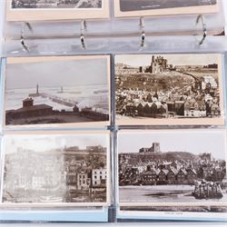 Two-hundred and thirty eight early 19th century to 20th century Whitby view postcards, including twenty-four early 19th century court cards, seventeen views of Whitby Abbey, forty depicting the fishing fleet and harbour, with a selection of cards providing a detailed study of the early 'Yards' the fisherman's dwellings around the harbour, all housed within a Stanley Gibbons Picture Postcard Album