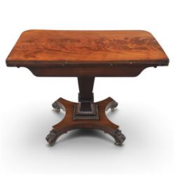 Victorian figured mahogany side table, fold-over swivel extending top, tapering square column above quatrefoil base