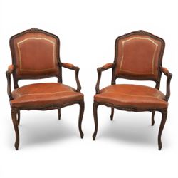 Pair of late 20th century French style carved beech open armchairs, the shaped and moulded...