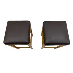 Pair of oak bar stools with leather type tops