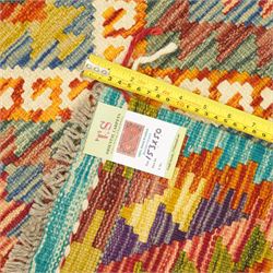 Afghan Maimana flatweave kilim and an Afghan Chobi flatweave kilim runner, with a repeating stepped diamond medallion design in ivory, green, rust, teal, purple, and indigo, framed by chevron and geometric borders, 153x50cm & 127x80cm, (2)