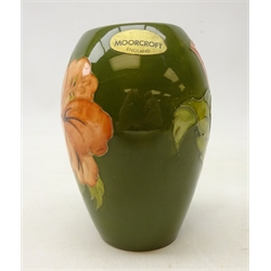  Moorcroft 'Hibiscus' pattern baluster shaped vase on green ground, H11cm  