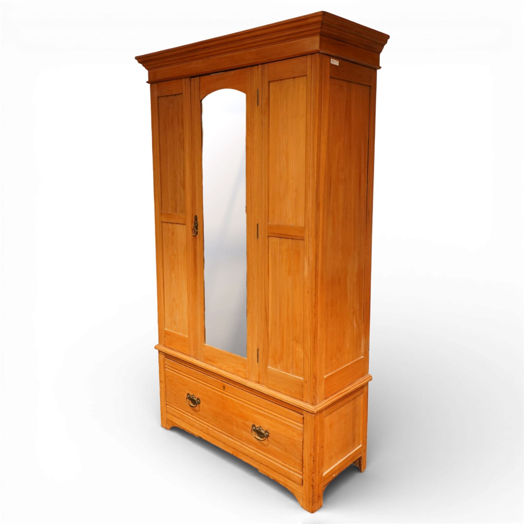 Edwardian ash single wardrobe, the moulded cornice above a single mirrored  hanging interior, flanked by panelled sections with drawer below, raised on bracket feet