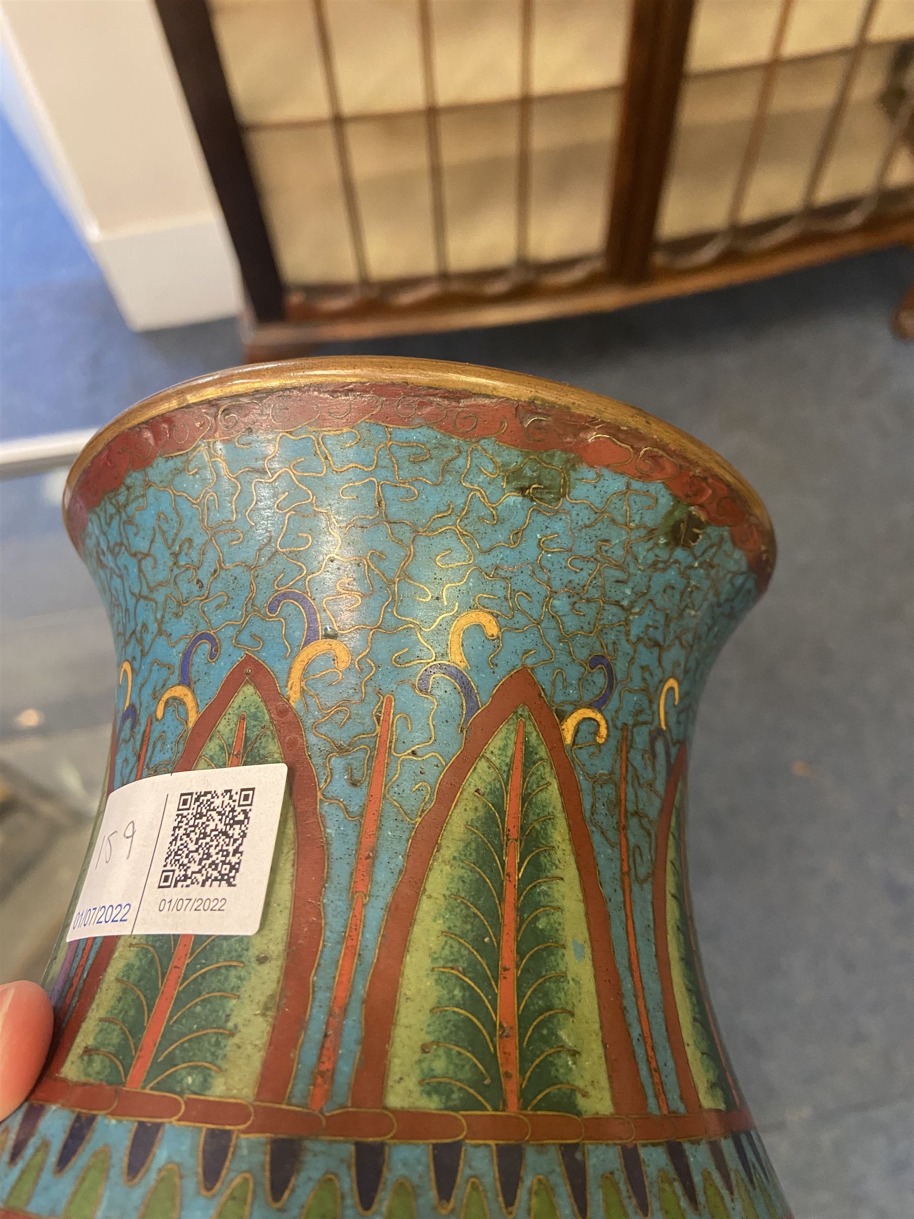 Japanese Cloisonne vase, Meiji/Taisho period, decorated with five haloed figures, possibly the Lucky Gods or Monks, in a landscape detailed with pine trees, lotus flowers and auspicious clouds, beneath a neck with band of fronds, with apocryphal Ming mark beneath, H31cm