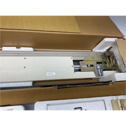  Brother cased knitting machine model KH-890 together with Brother Ribbing attachment model KH-850, knitting machine yarn cones in assorted colours, selection of knitting patterns etc