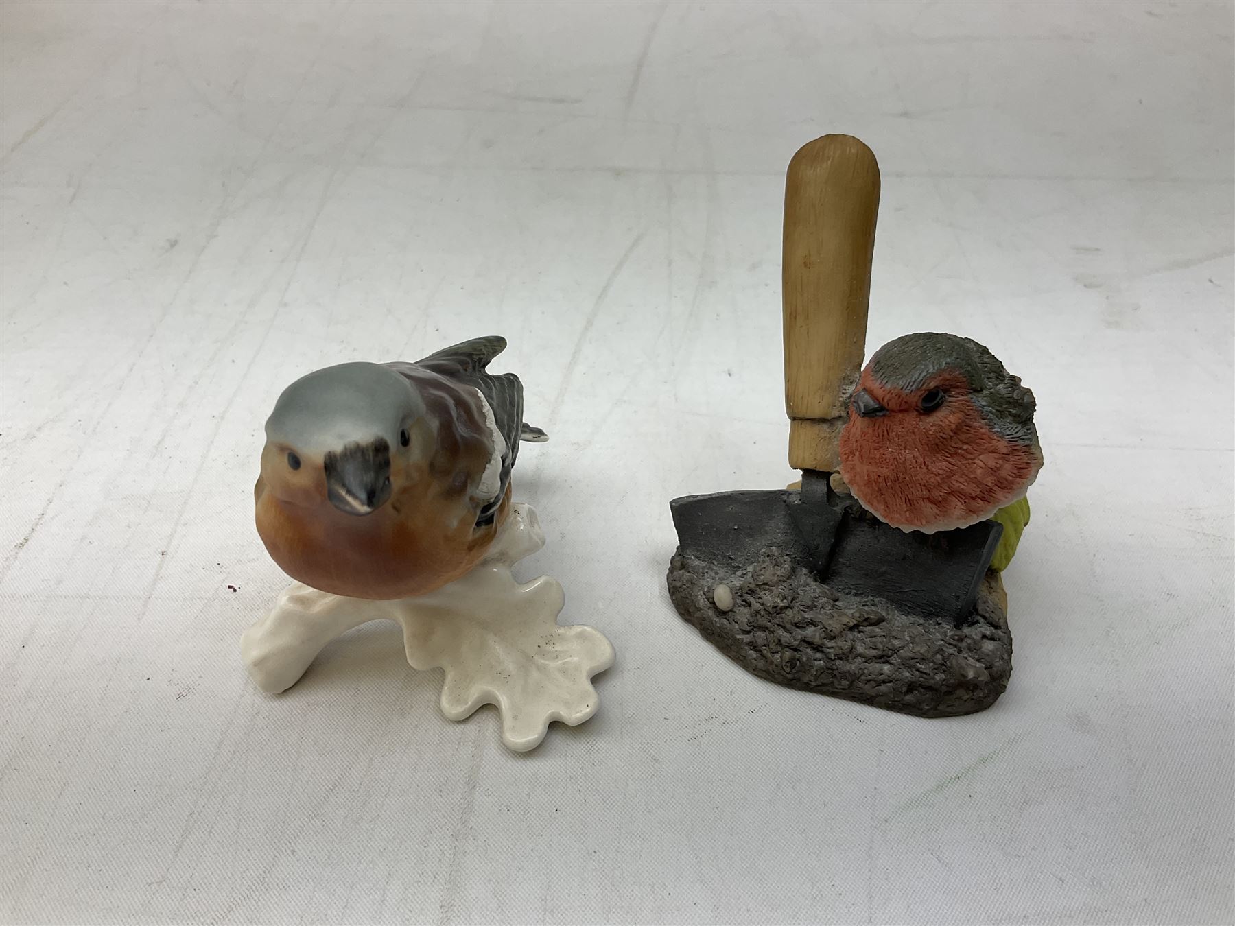 Lladro figure Ingenuine Woman no. 5487 (a/f), Nao figure, Goebel bird figure CV86 1967, Goebel Chaffinch 38023-06, Arden Scultpures robin figure group etc