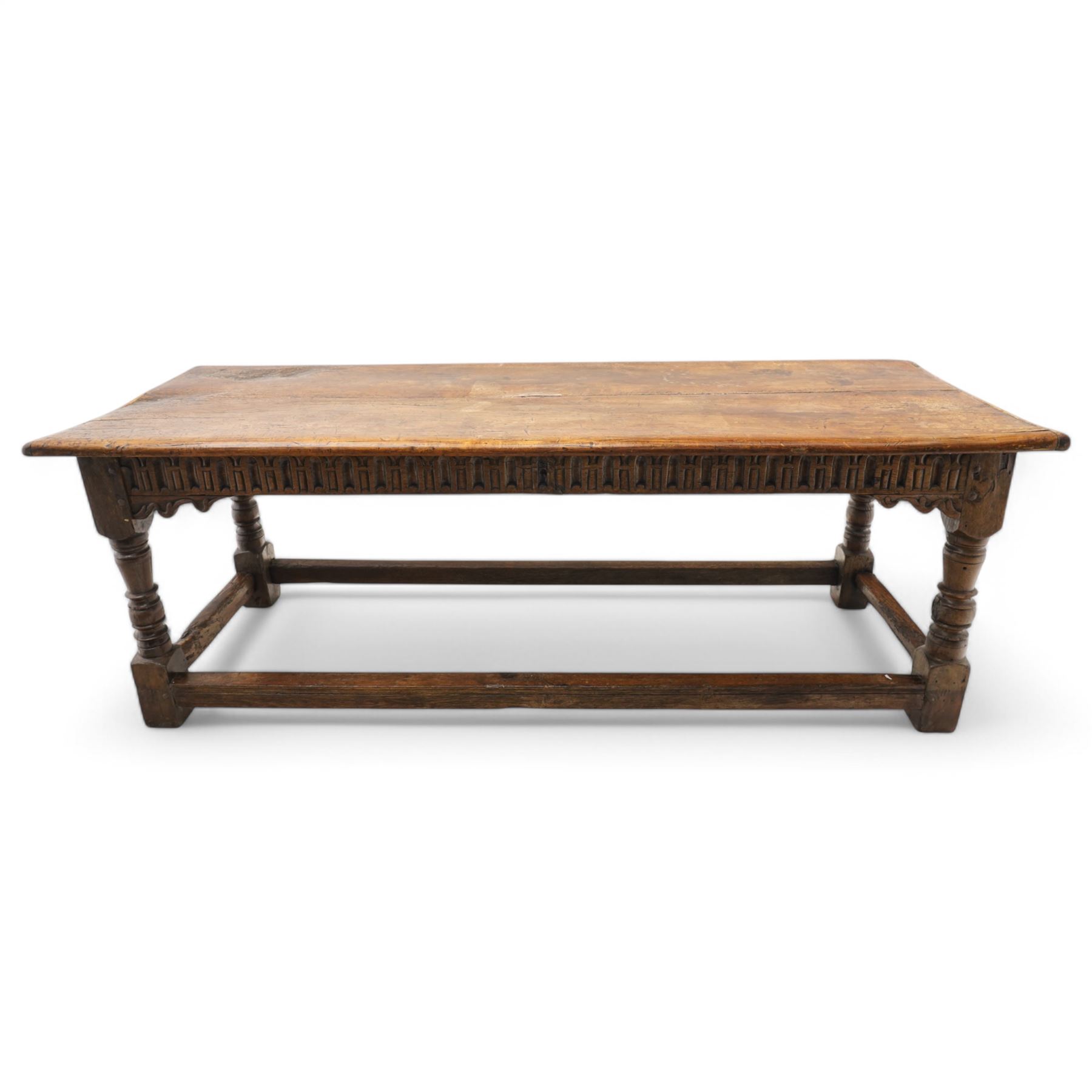 Charles I rectangular joined oak and elm refectory table, the frieze carved with repeated arch motifs, pearwood top above four turned supports united by horizontal stretcher, first half 17th century
Provenance: Purchased from Thorpe & Foster of Dorking in 1971
