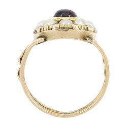 George III 9ct rose gold garnet and pearl mourning ring, single cabochon garnet, with split and seed pearl surround and pierced design shoulders, the back inscribed and dated 1808