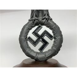 WW2 German cast white metal desk ornament/paperweight as the eagle insignia on later turned mahogany plinth H22cm