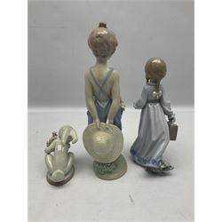 Three Lladro figures, comprising Pocketful of Wishes no 7650, School Days no 7604 and A New Friend no 1506, all with original boxes, largest example H26cm