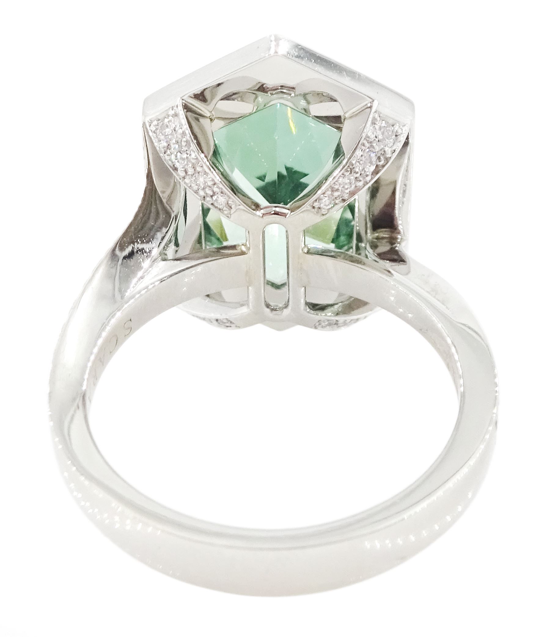 Platinum African Paraiba tourmaline and diamond ring by Scarab London, single fancy double bullet cut tourmaline of approx 8.37 carat, with round brilliant cut diamond surround and diamond set shoulders, London 2023, total diamond weight approx 1.05 carat, with Alan Poultney Gems report