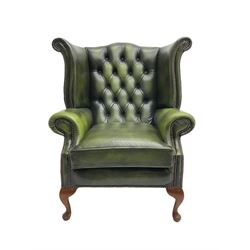 Georgian style wingback armchair, upholstered in buttoned green leather, on cabriole feet