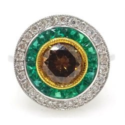  18ct white gold emerald, white and yellow diamond circular ring, stamped 750, central diamond approx 1 carat   