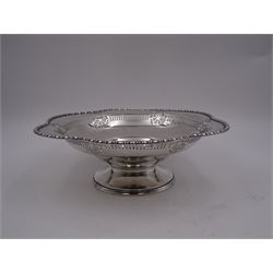 Early 20th century pedestal bowl, of circular form, with lobed bead and dart rim, the sides with pierced wheel, cross and dart decoration, upon spreading circular foot, hallmarked Barker Brothers, Chester 1917