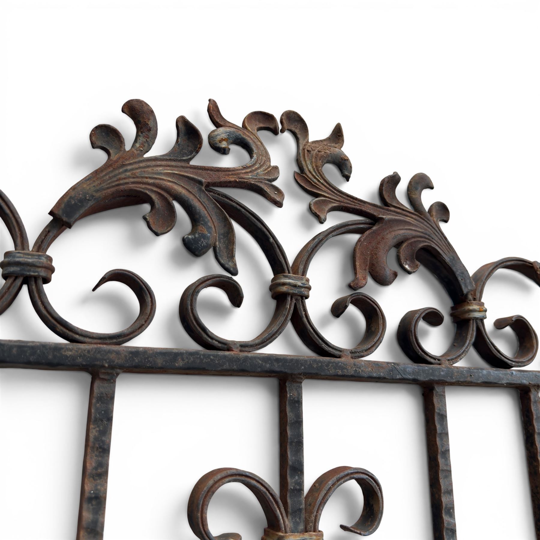 Victorian wrought iron vineyard gate, with ornate scrollwork and foliate acanthus leaf decoration, shaped cresting and central decorative panel, finished in rustic black painted finish