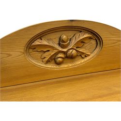 Pine chest of drawers topped with carved pediment with acorn and oak leaf motif, fitted with two short over three long drawers, standing on shaped apron base (W92, D46, H97cm); pine bedside cabinet, single drawer above paneled cupboard door enclosing open storage, shaped plinth base (W43, L32, H67cm)