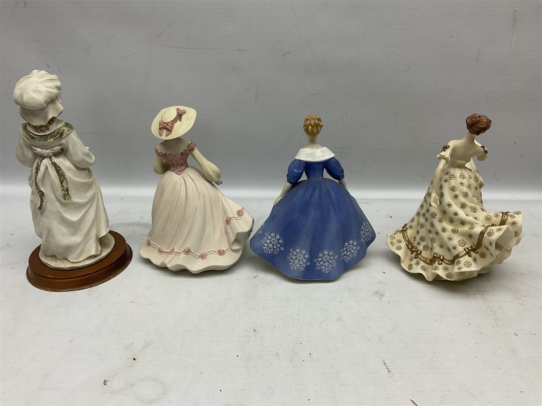Collection of eight figures comprising Royal Doulton Loretta HN 2337 and Nina HN 2347, Coalport limited edition Emily 740/5000, Danbury Mint Jean, SBL Regal House Collection and three The Leonardo Collection examples