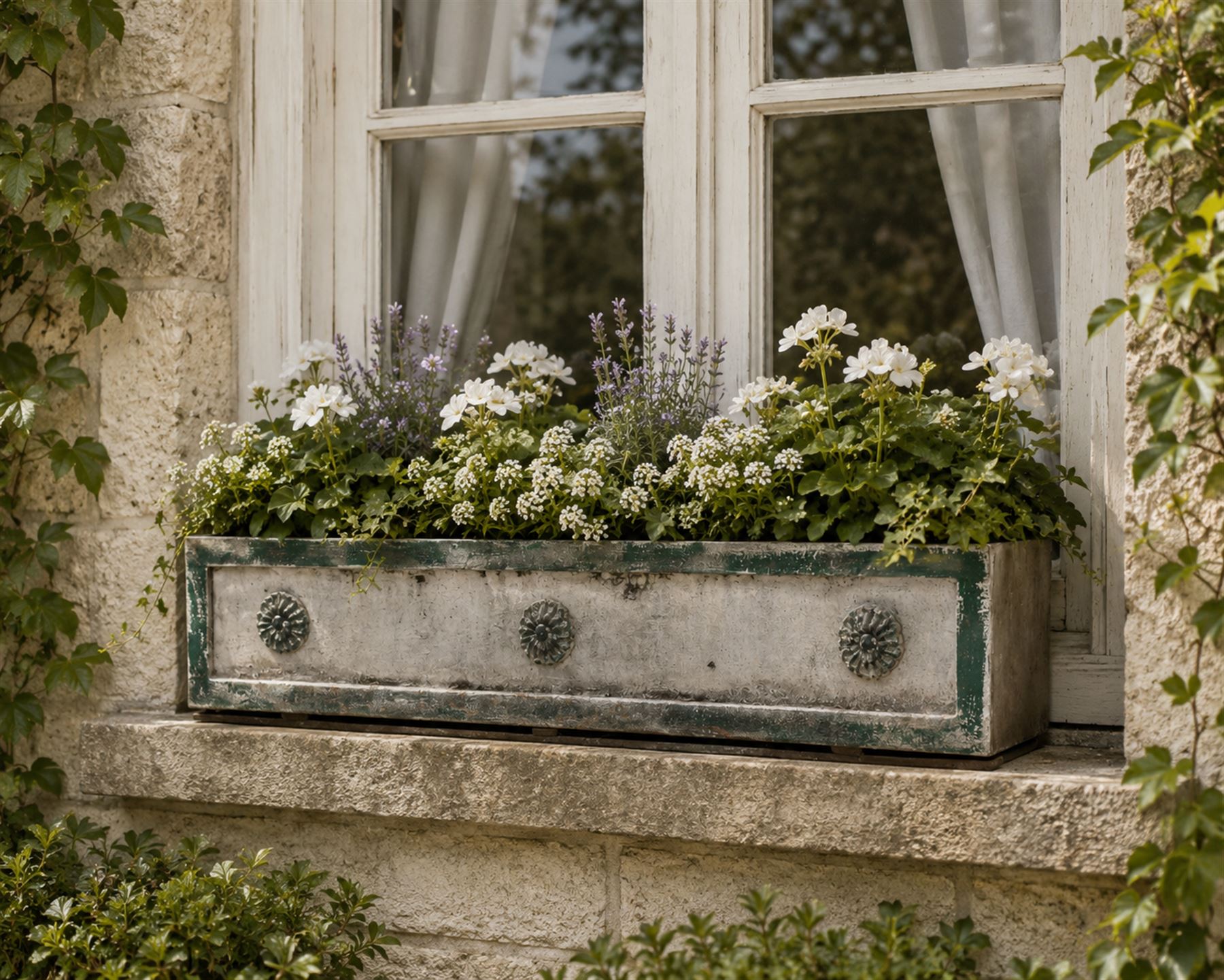 Early Victorian lead-fronted window box planter, of rectangular form with moulded borders and three applied flowerhead roundels, in distressed green finish