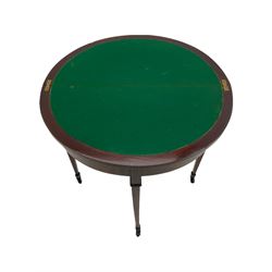 Edwardian inlaid mahogany demi-lune card table, fold over top revealing baize lined playing surface, raised on square tapered supports with peg feet and castors W76cm

