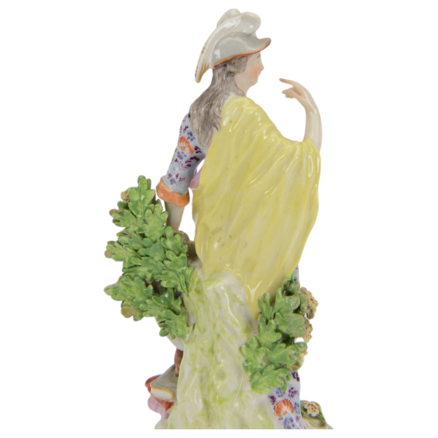 18th century Derby porcelain figure, circa 1775, modelled as Minerva, standing with mask shield, books and owl, against flowering bocage, upon a scroll base encrusted with flowers, H23cm