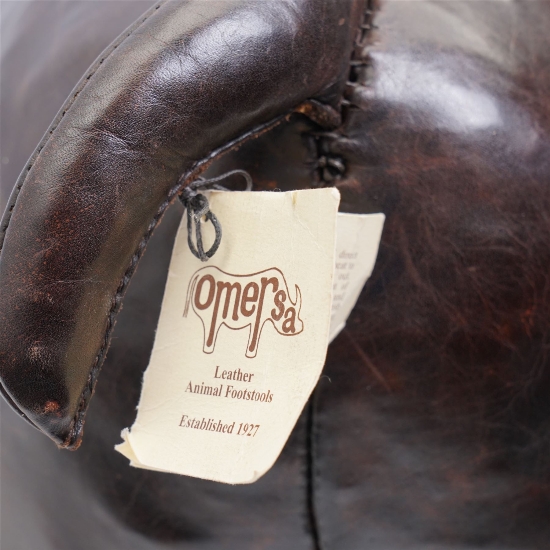 Omersa leather footstool in the form of hippopotamus, with silver 'The World of Thomas Sabo' charm collar, with original retail card tag, W80cm 