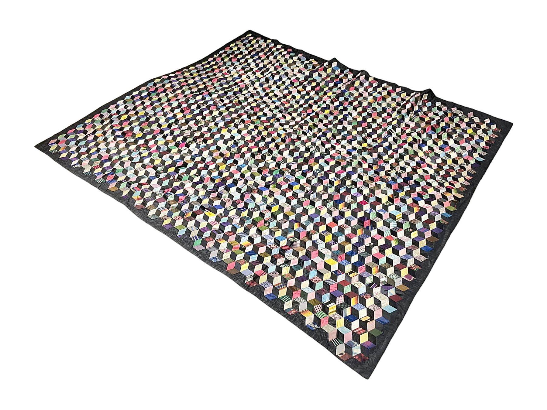 19th Century silk and satin tumbling blocks pattern patchwork quilt with black border 228cm X 196cm